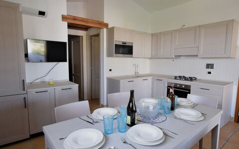 Luisa Apartment In Budoni, Shared Pool: Cabinetry, Controsoffitto, Proprietà, Elettrodomestico Da Cucina, Dishware, Tavola, Interior Design, Cucina, Elettrodomestico, Pavimento