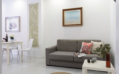 La Rondine Apartment: Mobilia, Interior Design, Divano, Parete, Pavimentazione, Pavimento, Soggiorno, Camera, Tavolo, Illuminazione
